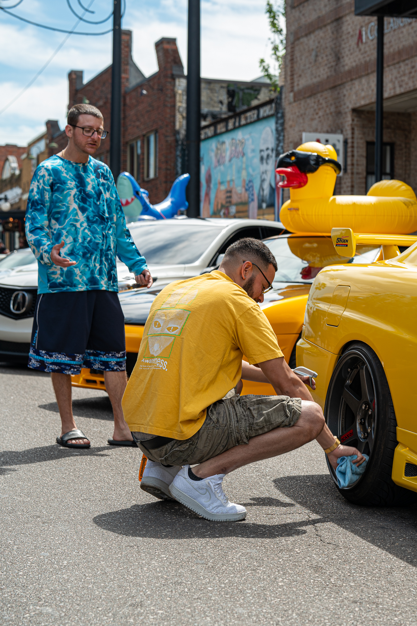 Yellow car in a street scene